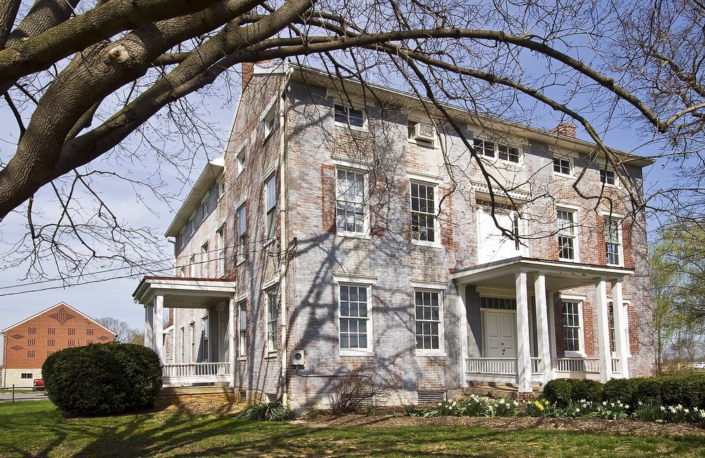 A historic American farmhouse, symbol of agricultural heritage